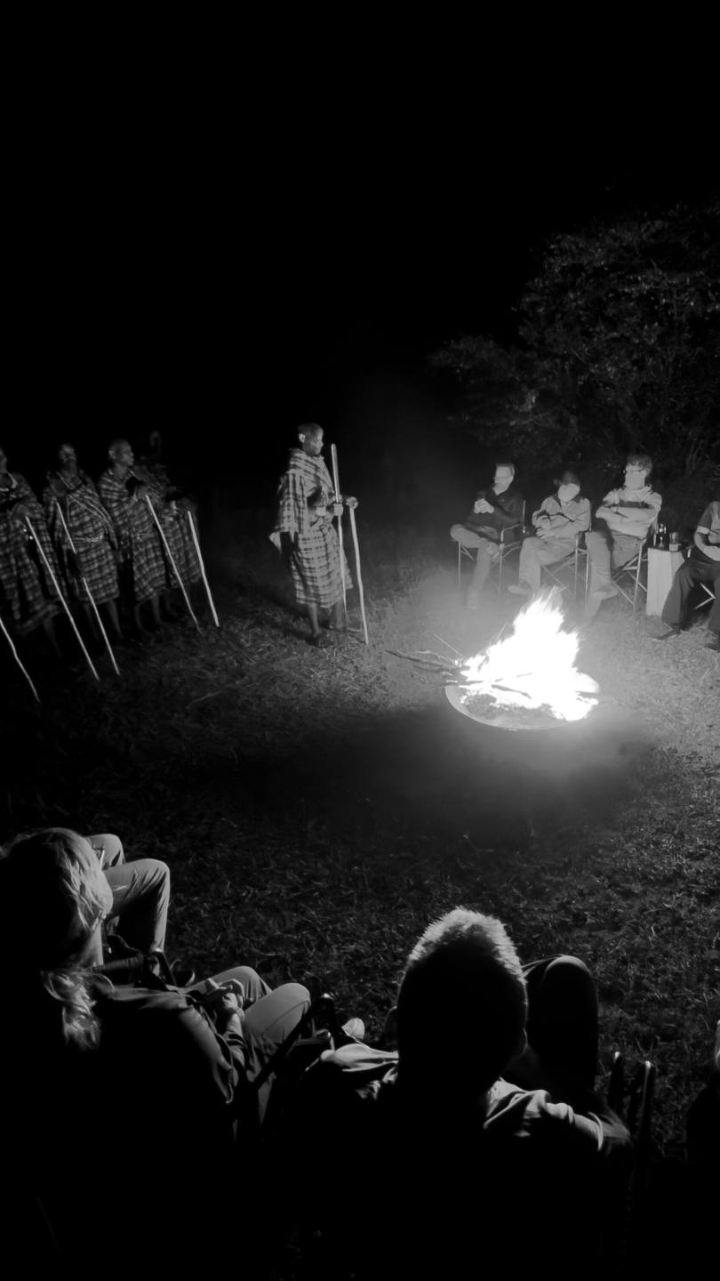Guests at Enkishui Safari camp enjoying a cultural evening
