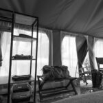 a view of the wrdrobe and mirror of a Enkishui Safari Camp guest safari tent